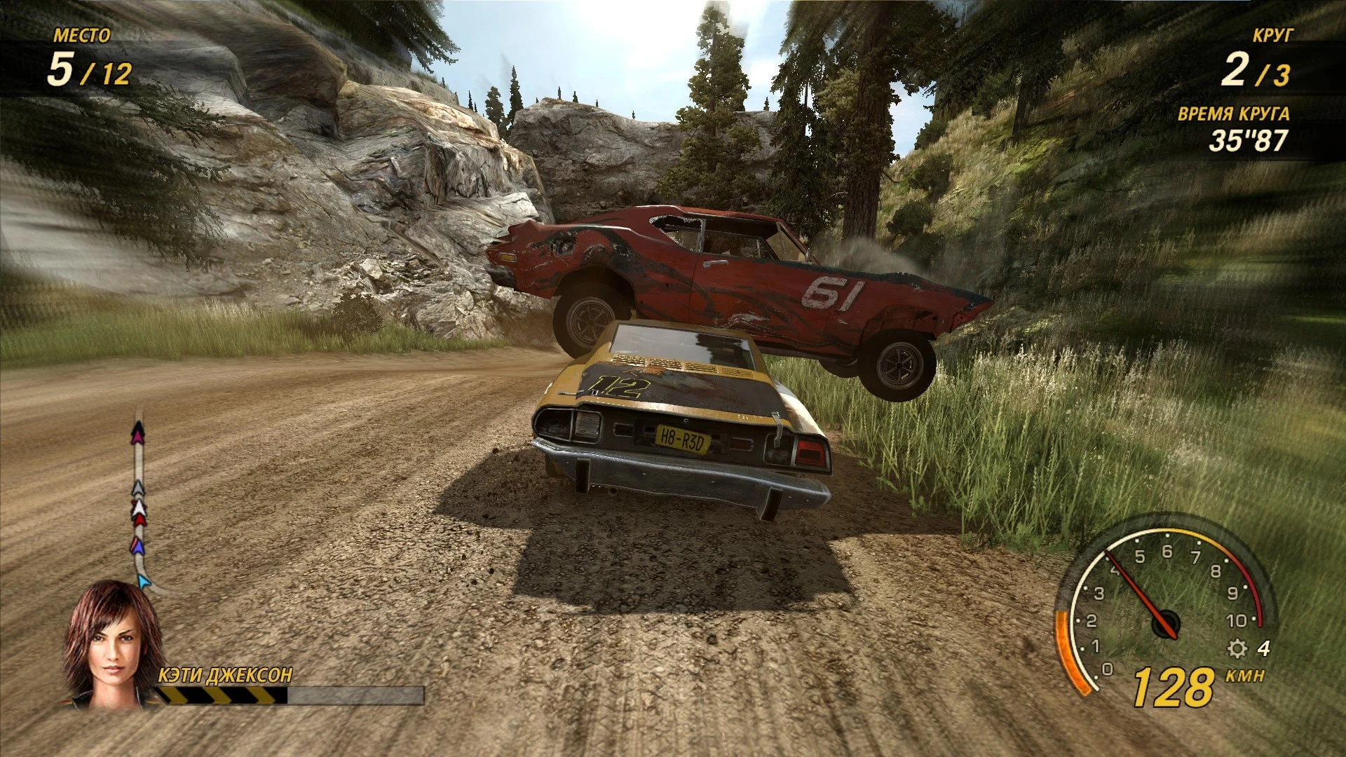 Two damaged cars collide on a dirt track surrounded by cliffs and trees in FlatOut Ultimate Carnage