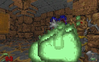 Spielercharakter in mittelalterlichem Verlies kämpft gegen großes grünes pixeliges Schleimwesen