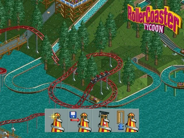 Zrzut ekranu czerwonej kolejki górskiej wijącej się przez drzewa i nad wodą z widocznymi ścieżkami parku w RollerCoaster Tycoon