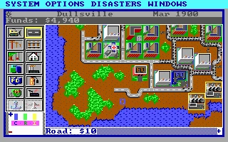 Pantalla de juego de SimCity 1989 mostrando el mapa de la ciudad, edificios, agua e interfaz con fondos y fecha