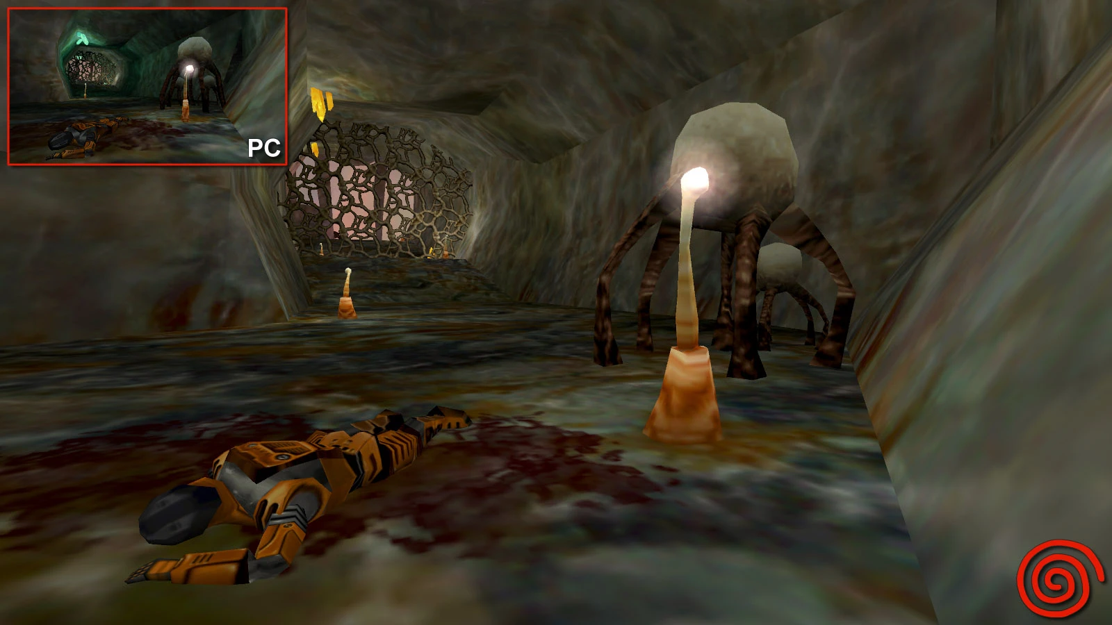 Captura de pantalla del mod Half-Life Dreamcast mostrando pasillo de cueva alienígena con cuerpo de zombi y criaturas brillantes