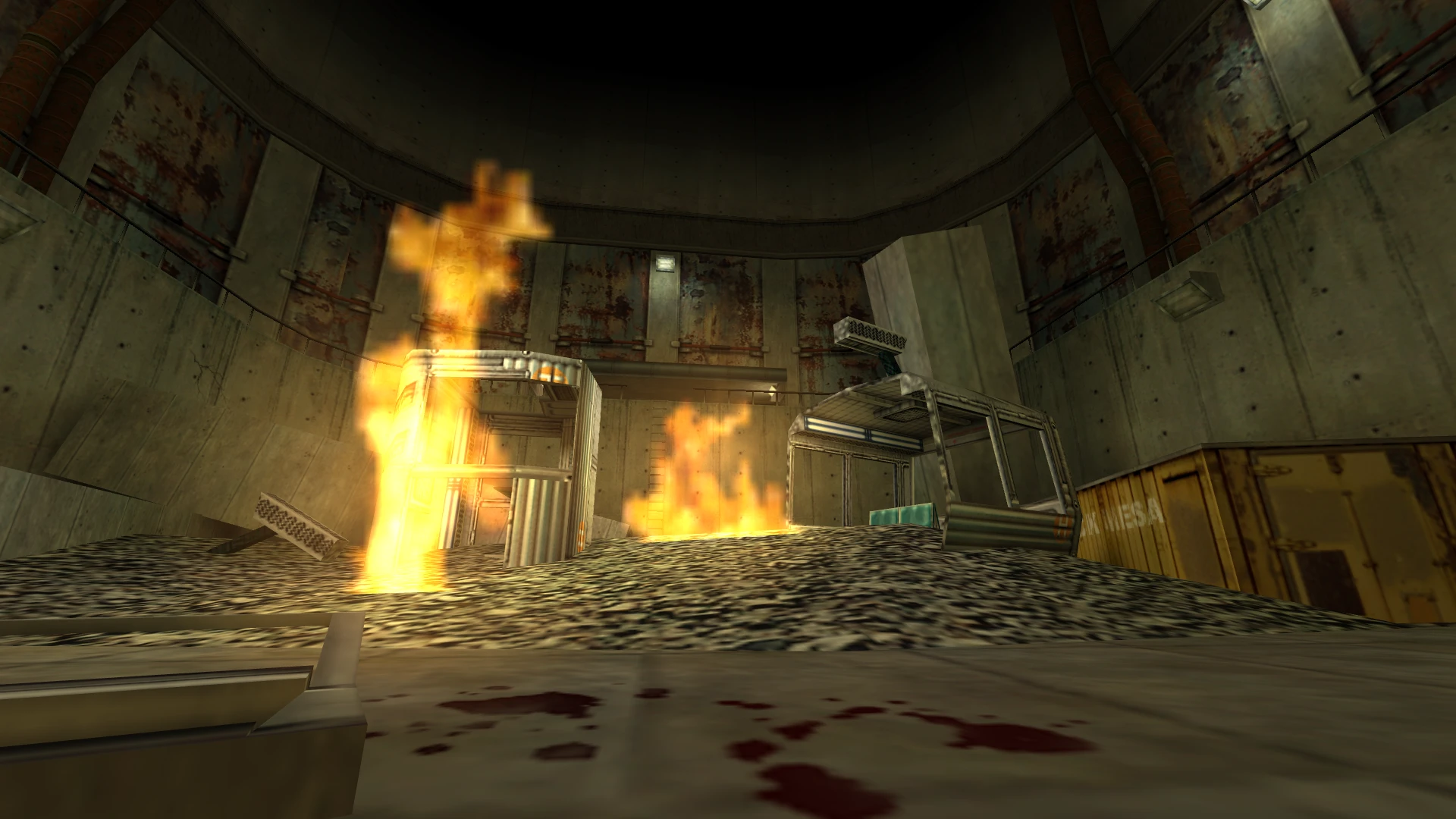 In-Game-Ansicht eines brennenden Trümmerhaufens in einer Beton-Industrieanlage im Half-Life: Insecure-Mod