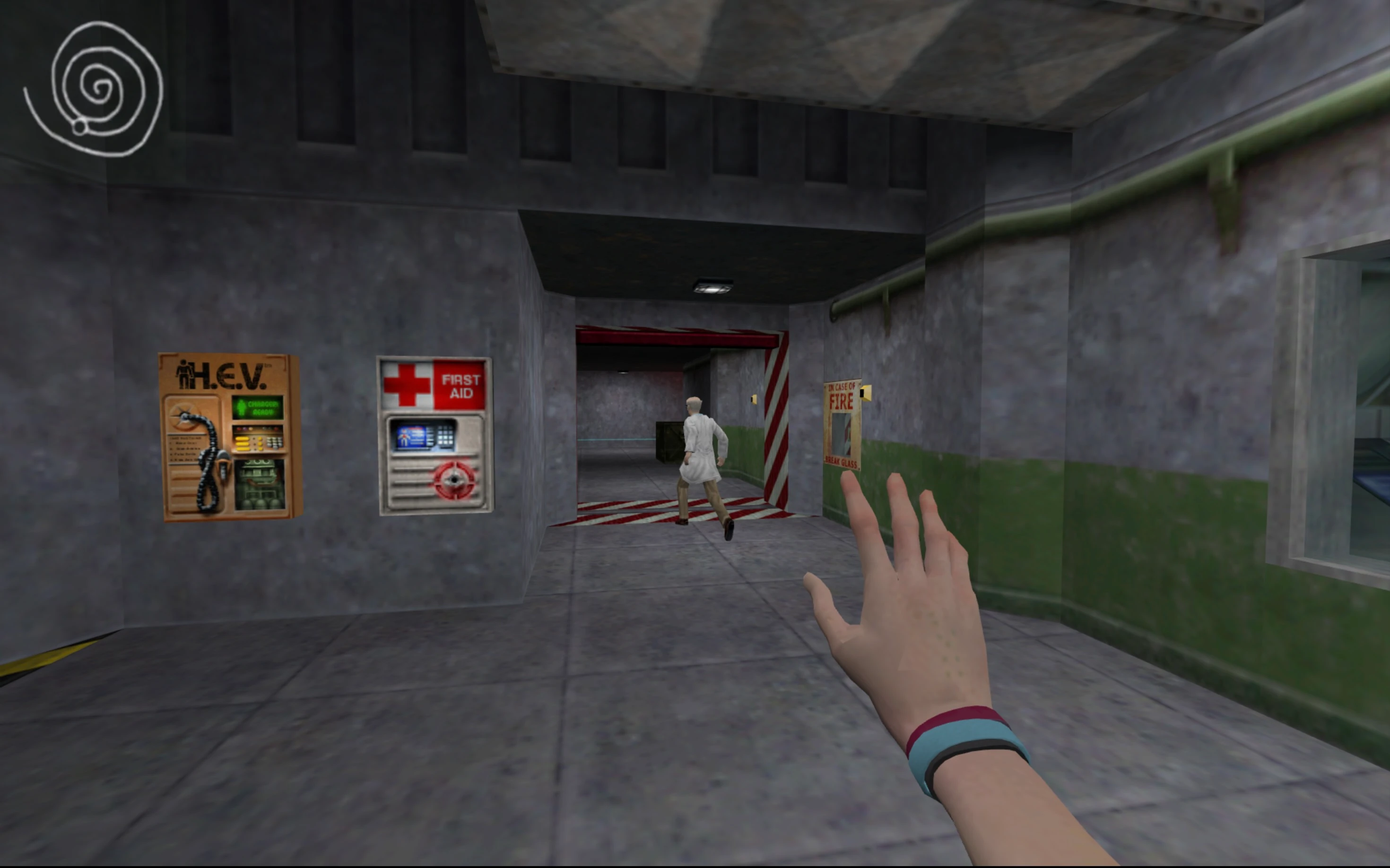 Player reaching out hand chasing running scientist through metallic corridors with first aid and H.E.V. stations