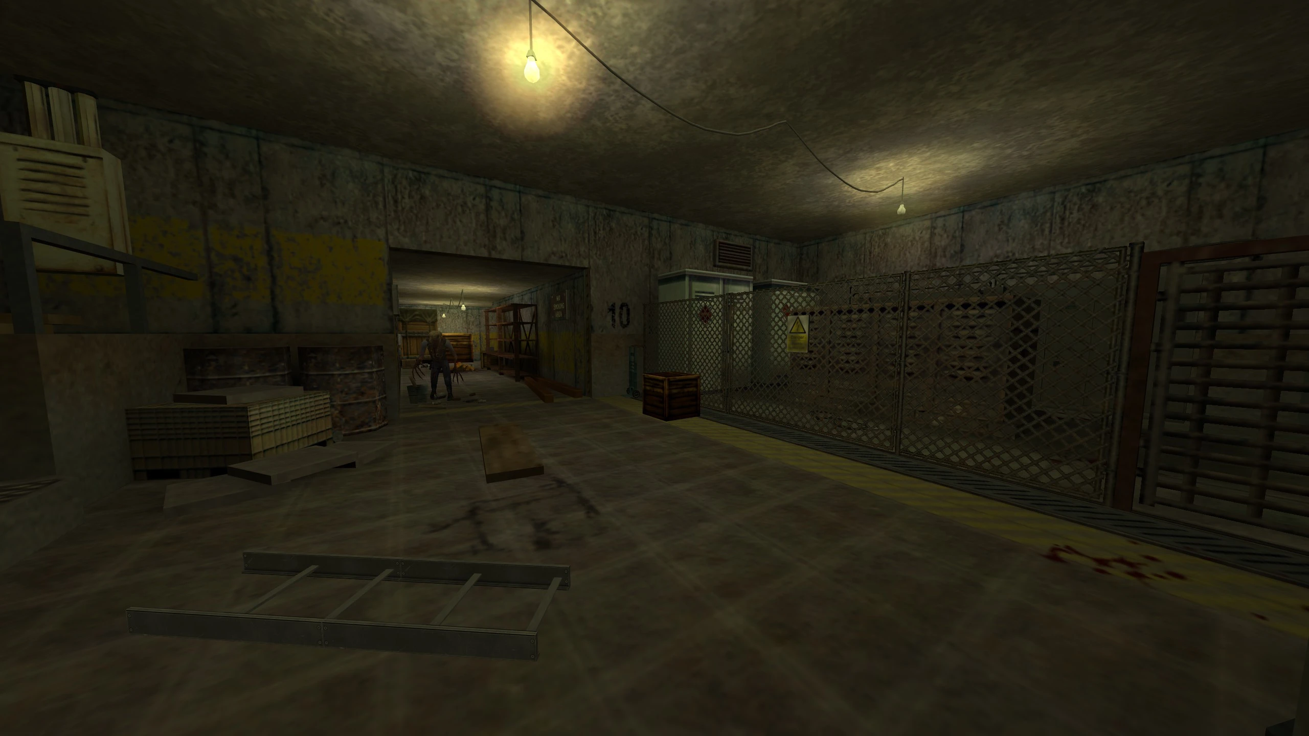 Dimly lit industrial underground corridor with clutter and a creature in Half Life NO - HOPE mod