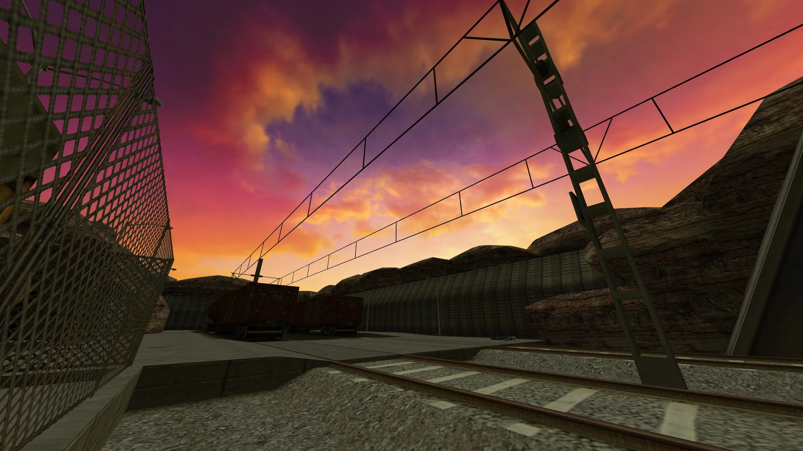 Train tracks with rusty cargo wagons and chain link fence at sunset in Half Life mod environment