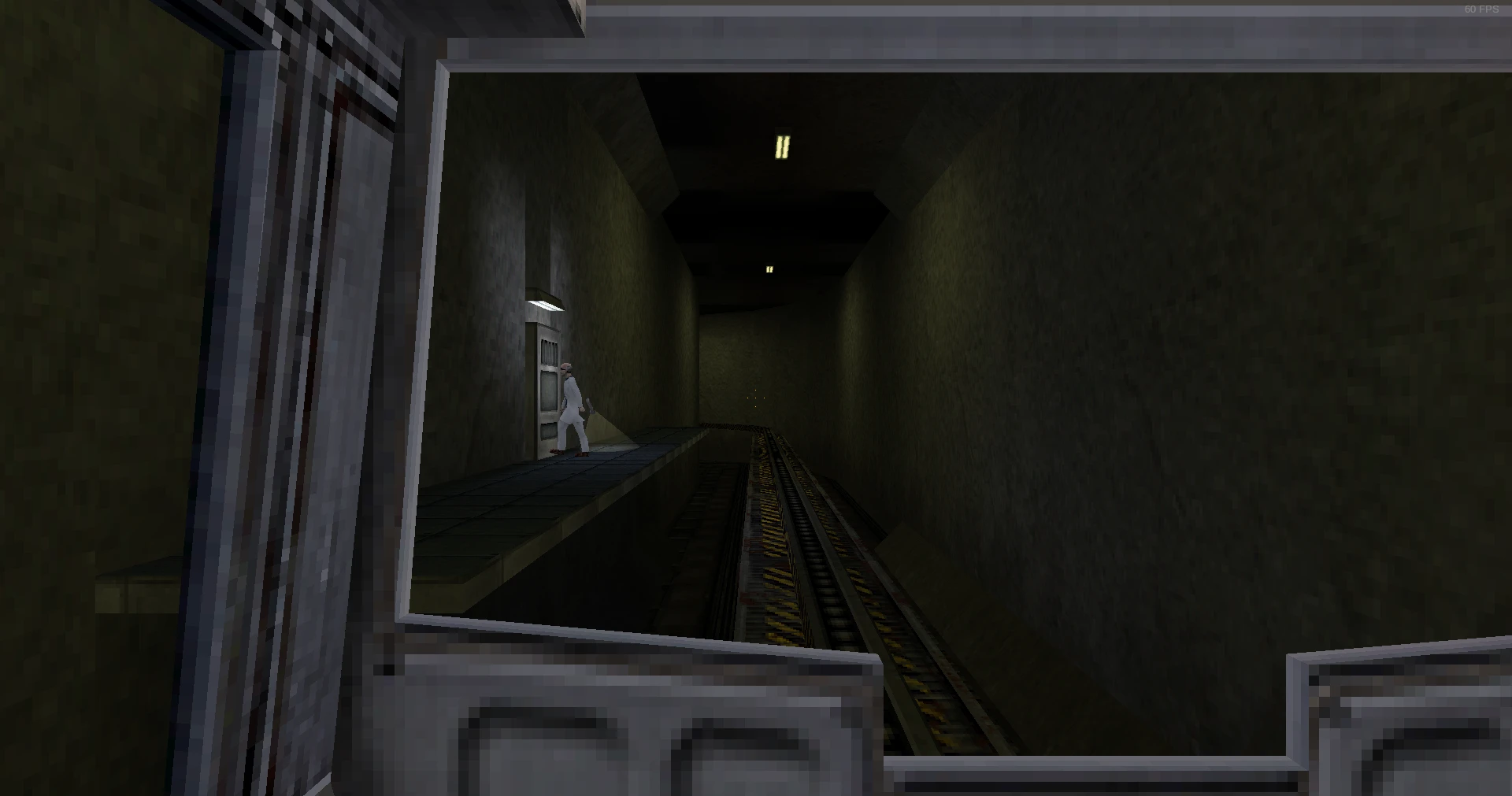 Widok poziomu Half-Life z pustymi podziemnymi torami kolejowymi i naukowcem przy drzwiach