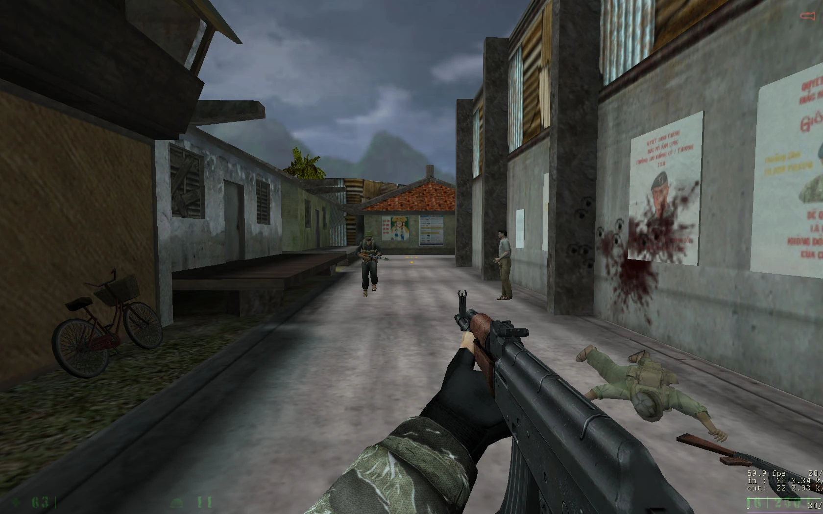 First-person view holding an assault rifle in an urban street with armed enemies and blood splatter on walls
