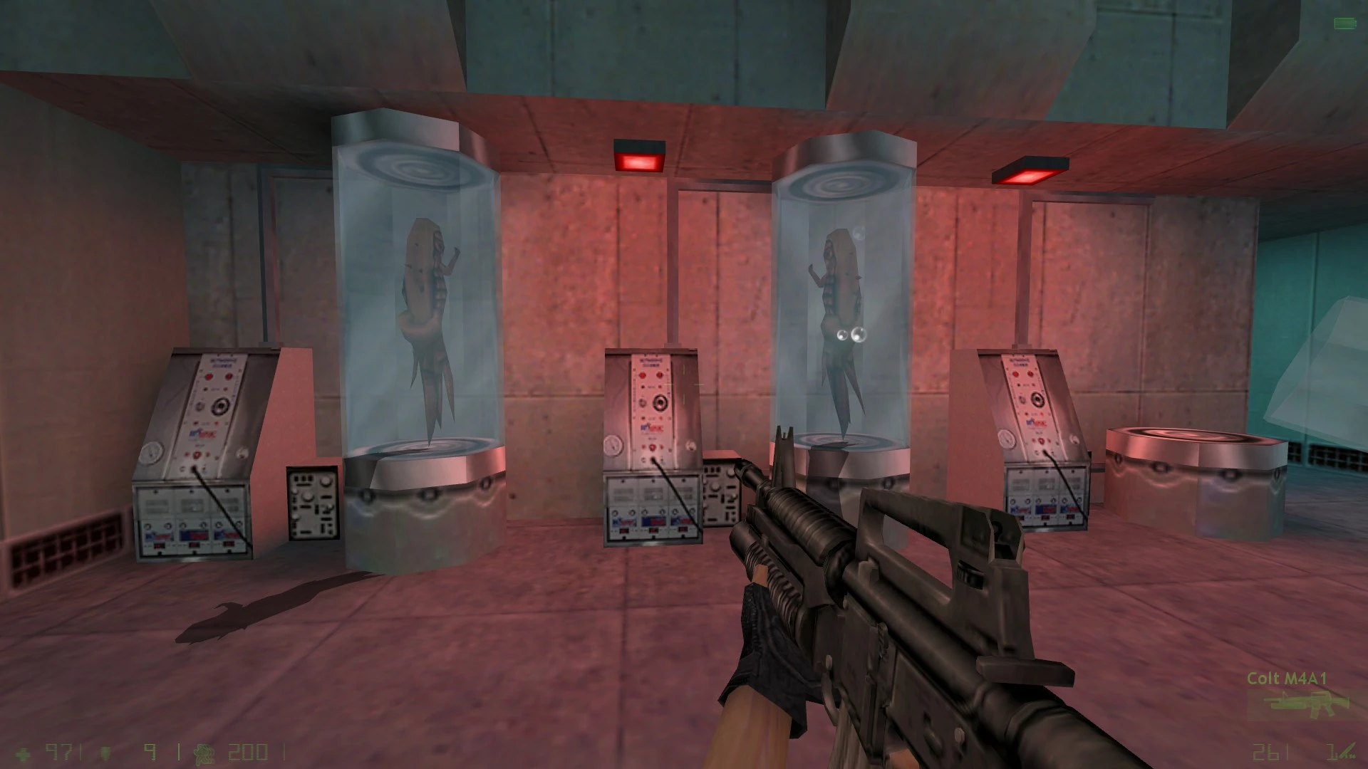 Player holding an M4A1 rifle in a laboratory with alien creatures in glass tubes in the Half-Life Opposing Force Enlightened mod