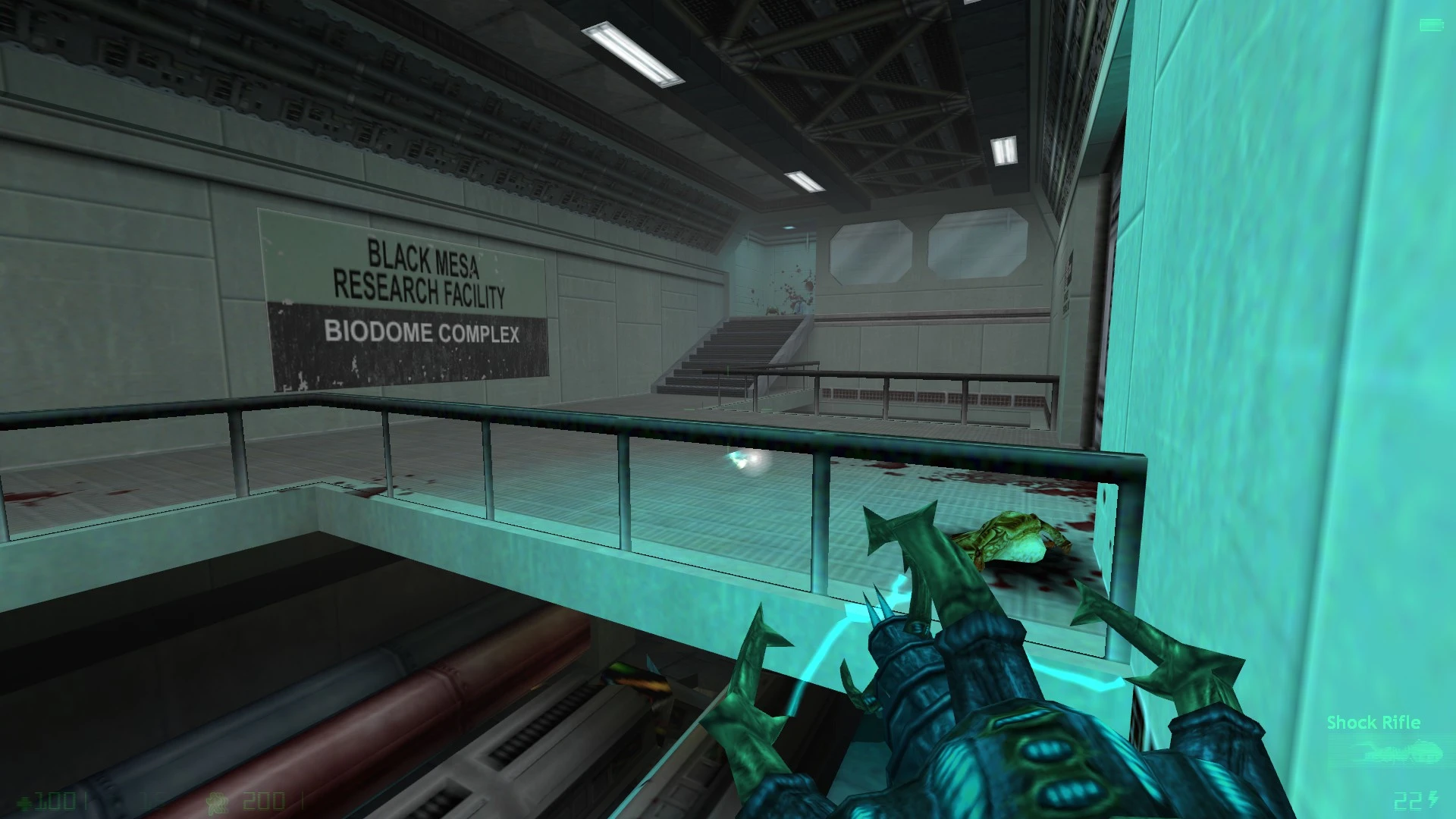 First-person view of player holding alien weapon inside Black Mesa Biodome Complex with blood splatters