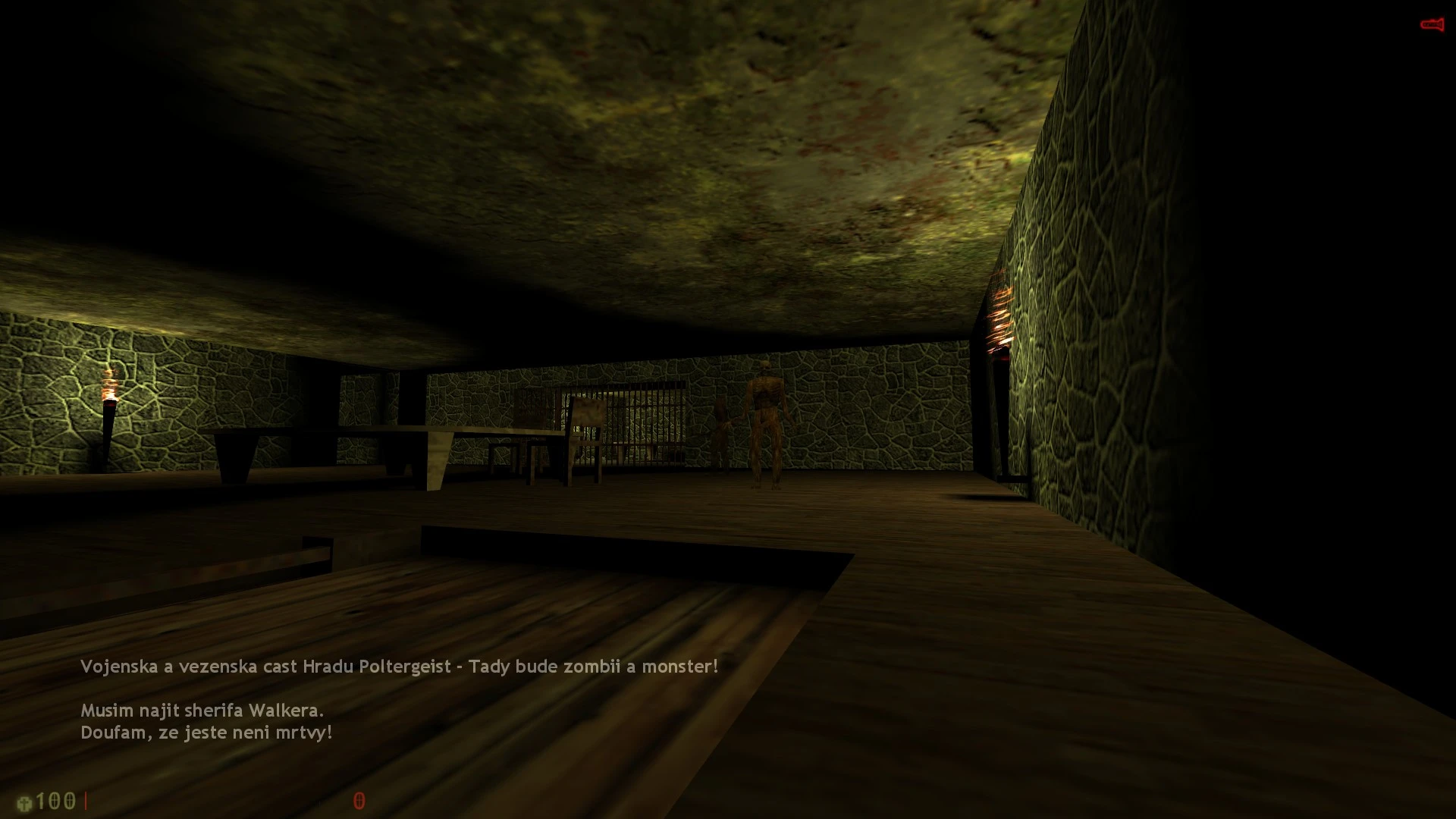 Dunkler Katakombenraum mit steinernen Wänden, Holzboden, Fackeln und humanoiden Zombies im Half-Life-Mod