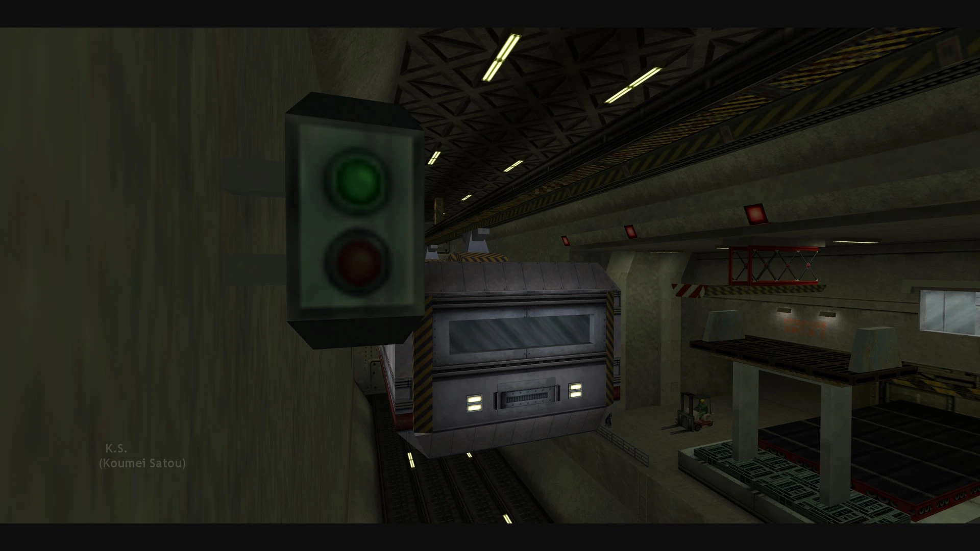 Half-Life screenshot showing a green light traffic signal and industrial train in a dimly lit tunnel area