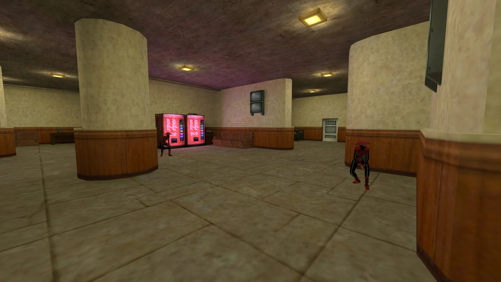 Two red-armored enemies crouching in a hallway near soda vending machines inside a Half-Life mod map