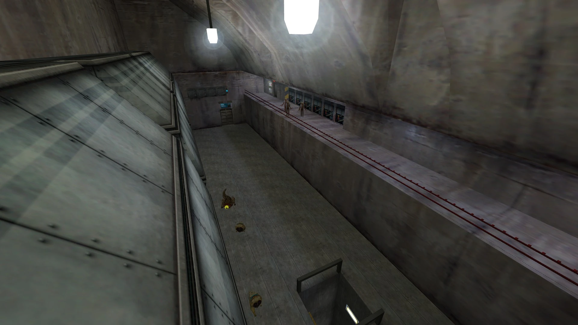 Screenshot of a large industrial room with concrete walls and two Half-Life monsters on the walkway
