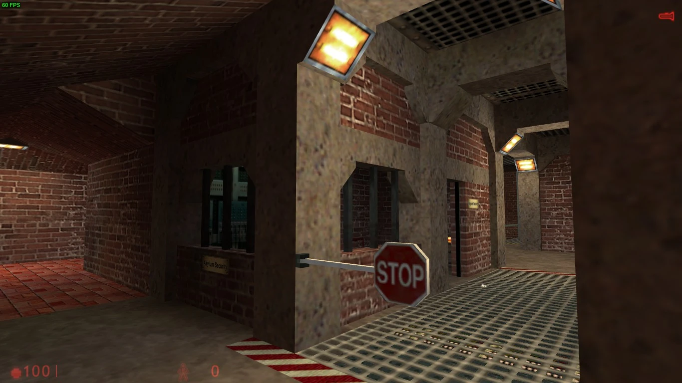 Escena interior con barrera de control de seguridad con señal de stop y luces industriales encendidas en un pasillo de ladrillo y metal de They Hunger Relit