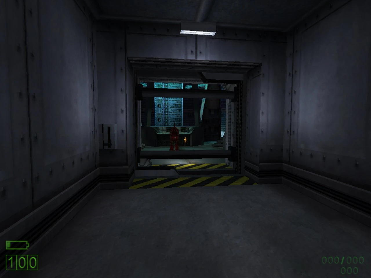View of a grey industrial corridor with hazard-striped floor and control panel in the background from Half-Life mod Triphammer