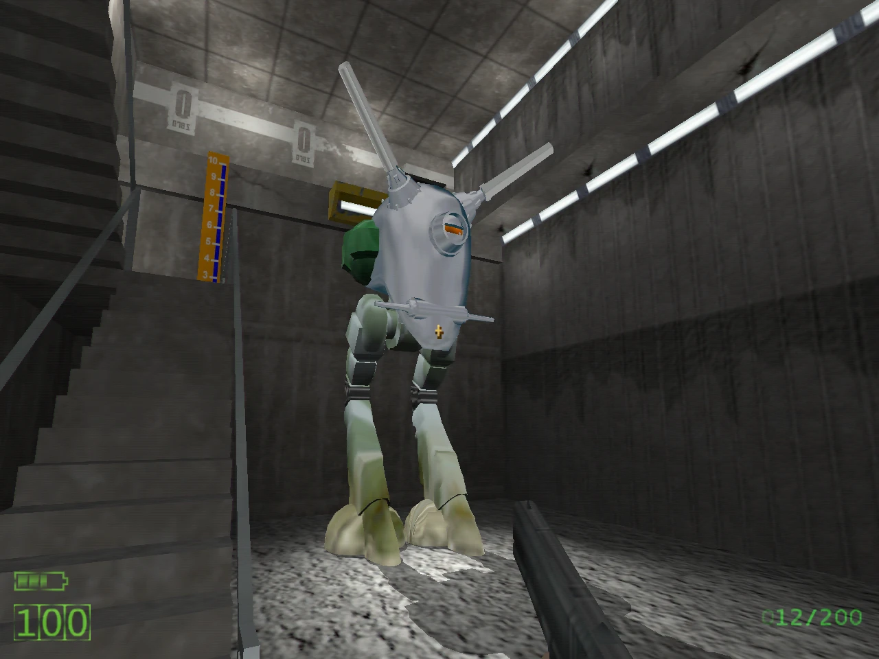 In-game screenshot showing a large two-legged mech robot inside industrial concrete facility