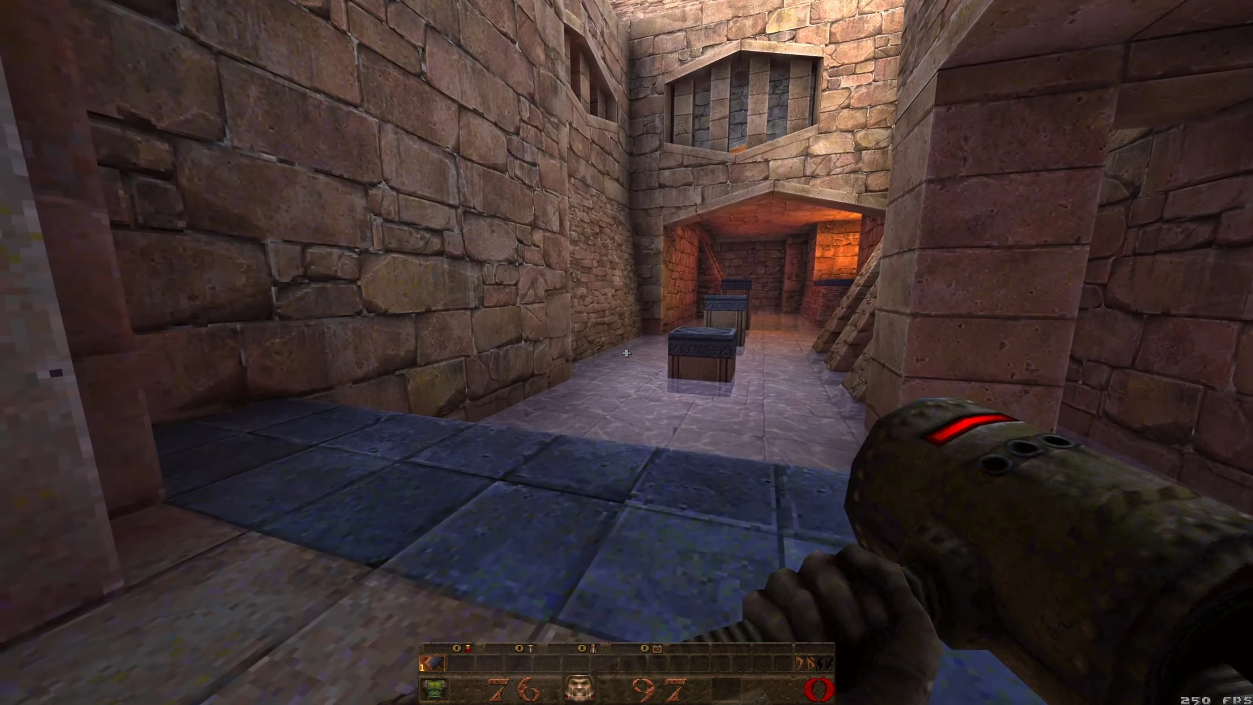 Zrzut ekranu z gry mod Quake Bonk Jam z graczem trzymającym broń w kamiennym korytarzu