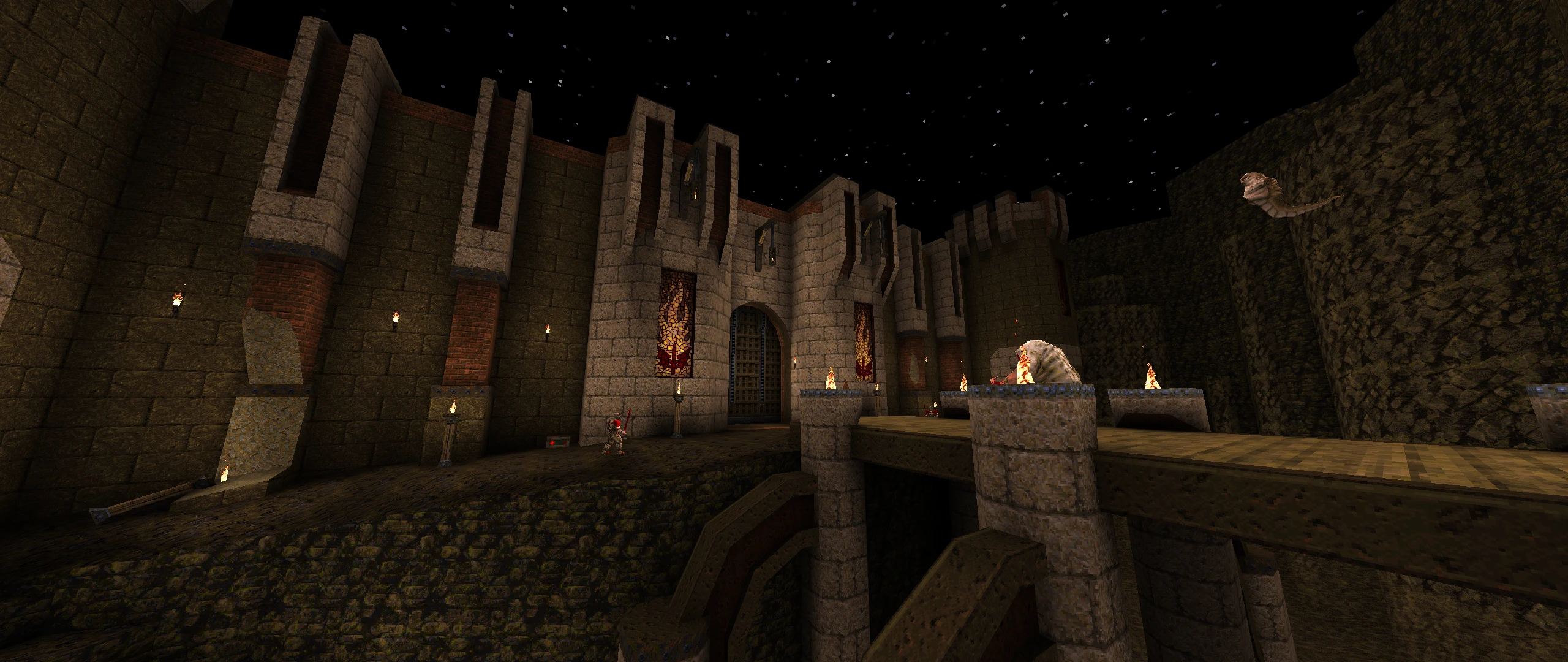 Batalla nocturna en una gran fortaleza de piedra con estandartes medievales y enemigos en el mod Quake Epochs of Enmity