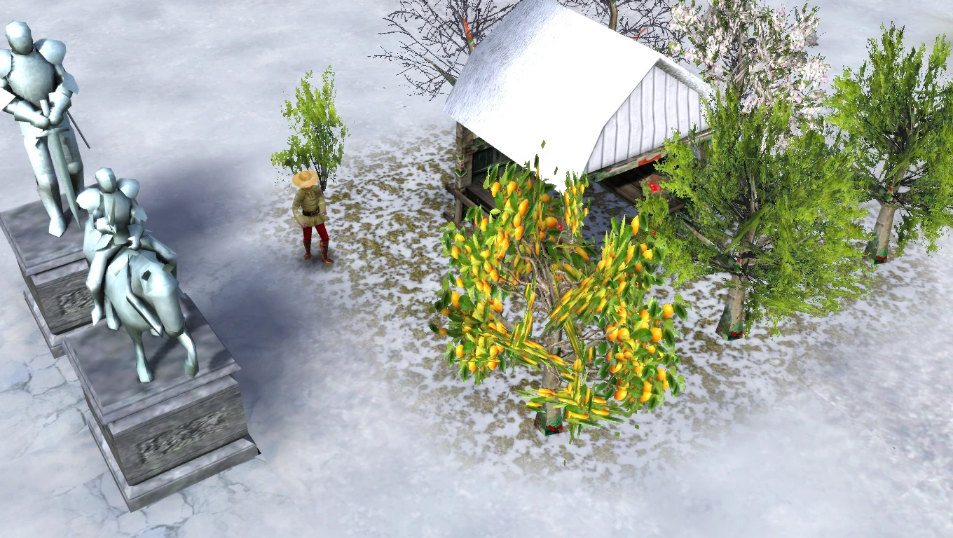 Eine verschneite Dorfszene mit Statuen, Bäumen und einem kleinen Haus im Weihnachts-Winter-Mod von Stronghold 2.