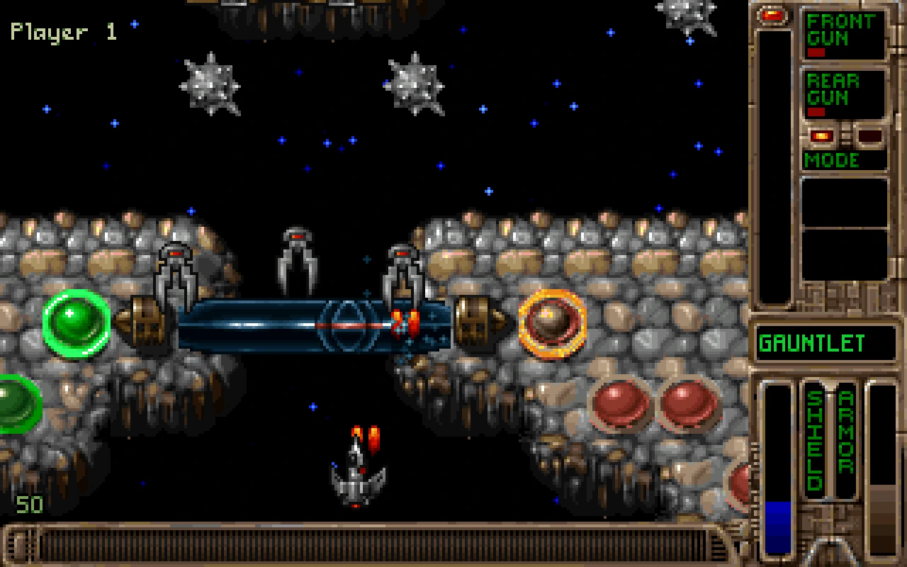 Tyrian 2000 gameplay showing a spaceship navigating an asteroid field with weapon and shield indicators