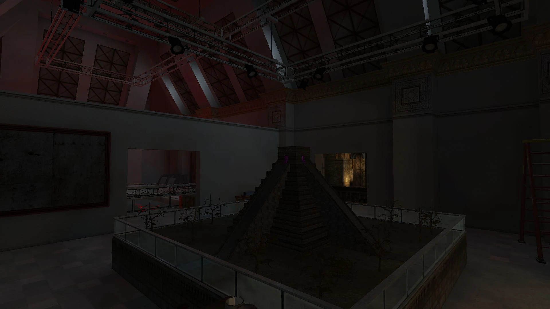 Dimly lit indoor museum space showing a small pyramid exhibit surrounded by glass and plants in VTMB Prelude mod