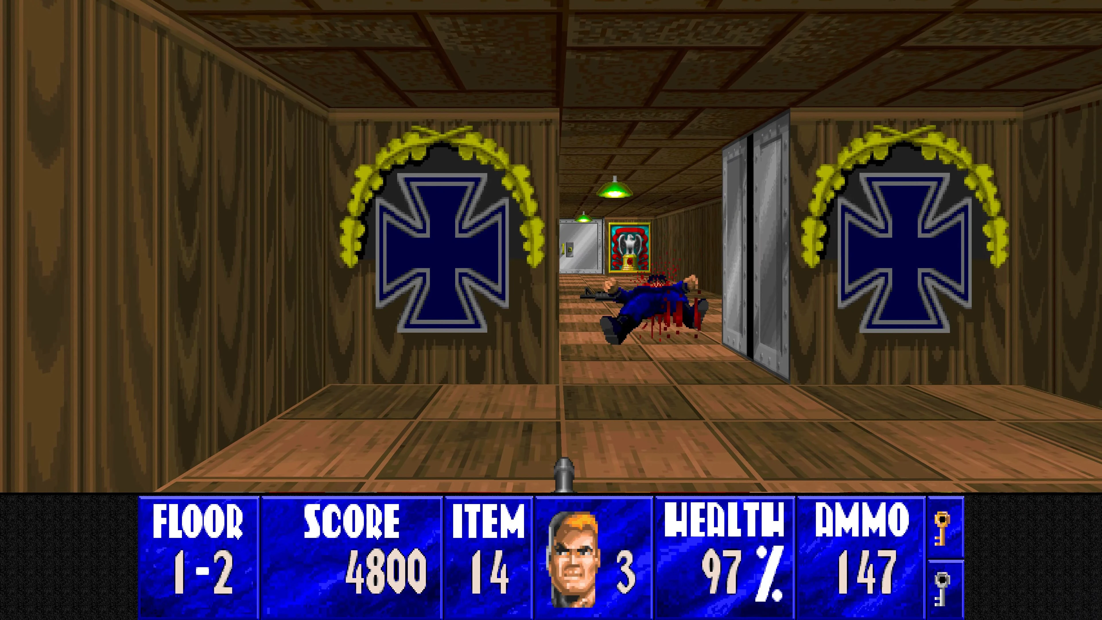 Widok z pierwszej osoby w modzie Wolfenstein 3D HD z drewnianymi ścianami, niebieskimi żelaznymi krzyżami i pokonanym wrogiem w korytarzu